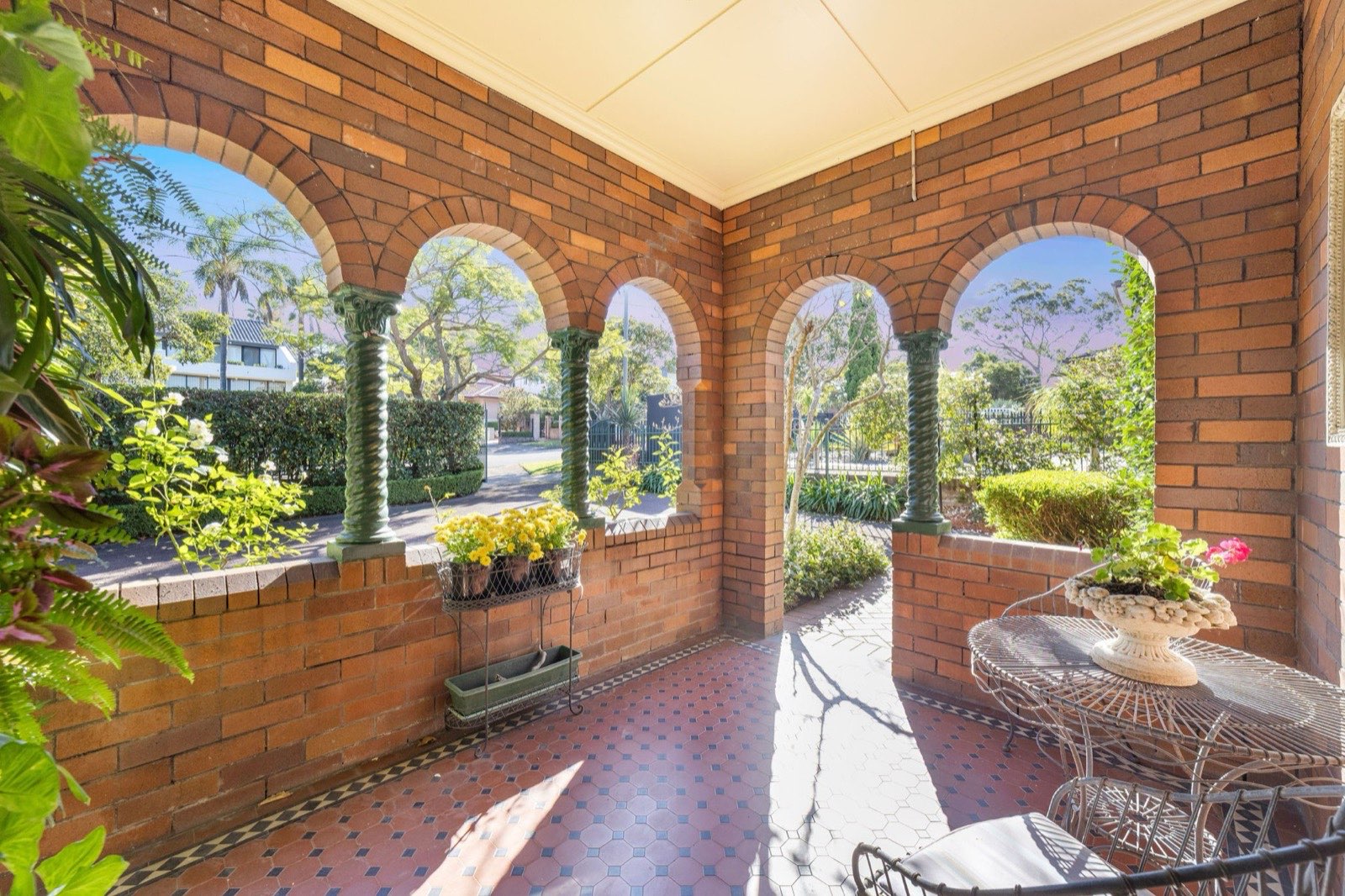 Arched brick colonnade overlooking the garden at 32 Wallis Avenue